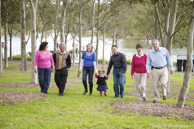 3 generations of family walking and laughing - family portrait photography sydney